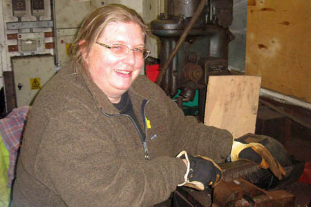 Claire Emsley cleaning guard iron bolts - Clive Emsley