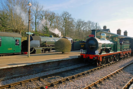65 waits whilst 847 brings its train into Horsted Keynes - Brian Lacey - 24 February 2018