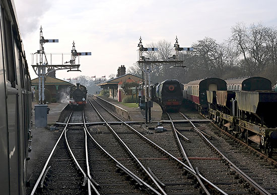 As Camelot's train pulls into Horsted Keynes, the H-class is already in the platform with its northbound service - Brian Lacey - 27 December 2018
